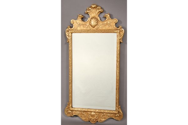 ENGLISH WILLIAM KENT STYLE GILT DECORATED MIRROR: English William Kent Style gilt decorated mirror with feather, eagle head and shell decoration. Ht: 45 Width: 23" ***PLEASE NOTE: All property shall be paid for by the purchaser within five (5) busine