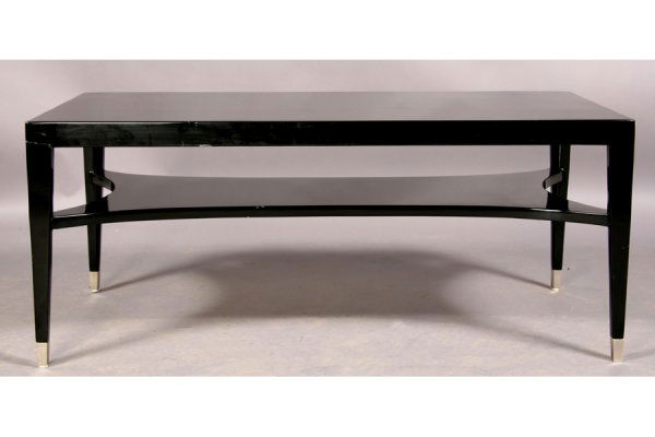ANDRE ARBUS STYLE EBONIZED COFFEE TABLE: Andre Arbus style ebonized coffee table with shaped lower shelf, tapered legs and capped feet. a Ht: 20.5 Width: 48" Depth: 24" ***PLEASE NOTE: All property shall be paid for by the purchaser within f