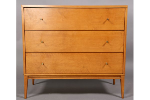 MODERN LABELED PAUL MCCOBB CHEST OF DRAWERS: Mid century modern labeled Paul McCobb Planner Group chest of drawers with three drawers raised on tapered legs circa 1950. Ensuite with the previous two lots. Ht: 33.5 Width: 36" Depth: 18" ***PLEASE