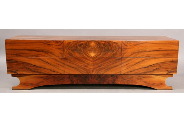 MODERN CREDENZA EXOTIC BOOKMATCHED TOP AND DRAWER: Mid century modern credenza with exotic bookmatched top and drawer fronts raised on arched and shaped base circa 1960. Ht: 19 Width: 63" Depth: 16.5" ***PLEASE NOTE: All property shall be paid for by