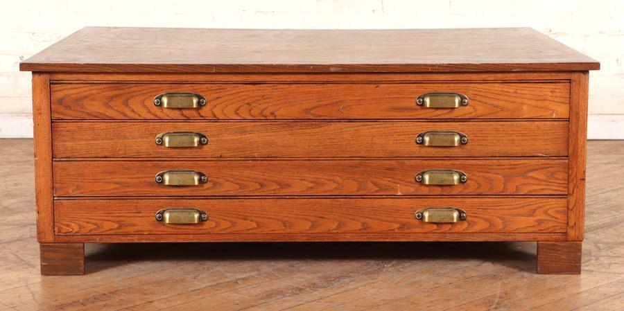 FLAT OAK FILE CONVERTED TO A COFFEE TABLE: A flat oak file converted to a coffee table. Ht: 18.75" Wd: 47.75" Dpth: 35.5"