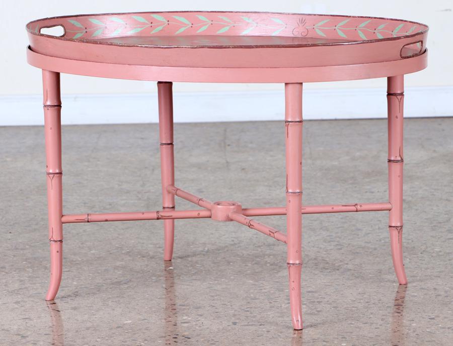 VINTAGE PINK PAINT DECORATED TRAY TABLE C.1940: A vintage pink paint decorated tray table with removable oval tray circa 1940. Ht: 19" Wd: 30.5" Dpth: 23.5"