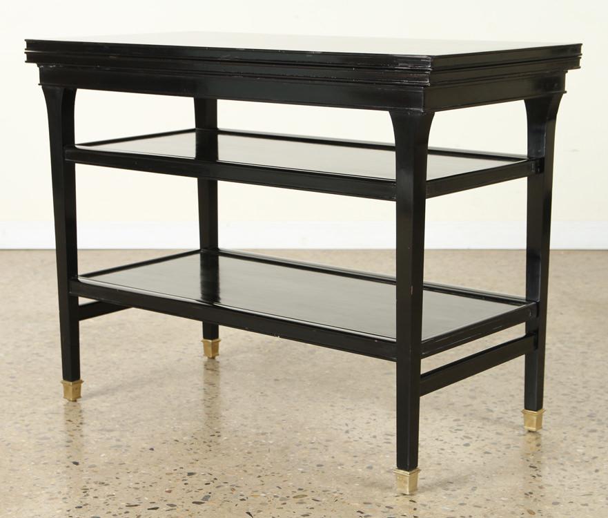 JANSEN EBONIZED METAMORPHIC FLIP TOP BAR CART: A Jansen ebonized metamorphic flip top bar cart circa 1945. Having two pull out surfaces. Ht: 27" Wd: 35.5" Dpth: 17.5"