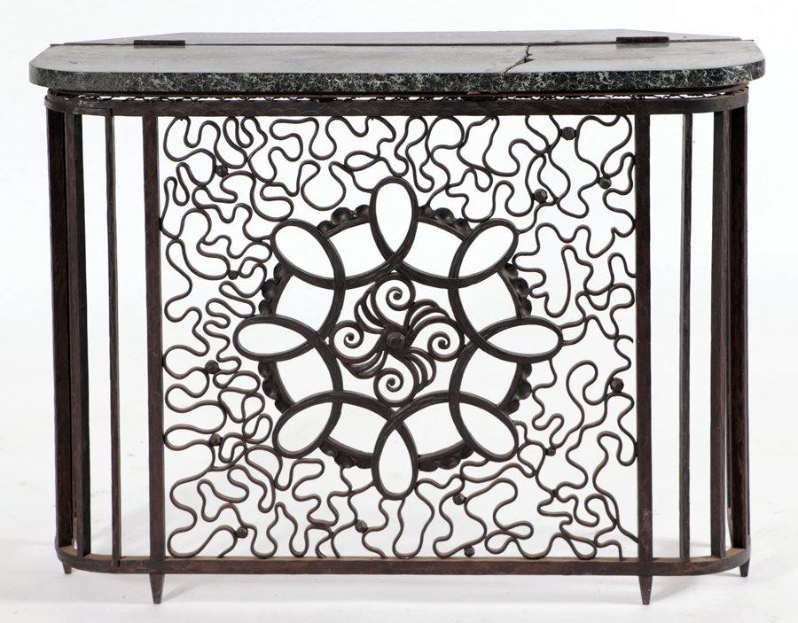 FRENCH ART DECO CONSOLE ATTR. RAYMOND SUBES 1930: A French Art Deco wrought iron and marble top radiator cover/console table attributed to Raymond Subes circa 1930. The rear edge of the top is hinged and opens for access. Ht: 27" Wd: 37" Dpth: 14"