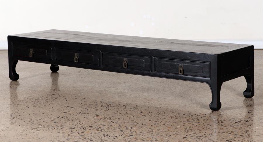 CHINESE EBONIZED TEAK COFFEE TABLE: A Chinese ebonized teak coffee table having three drawers. Ht: 12.75" Wd: 65" Dpth: 17.75"