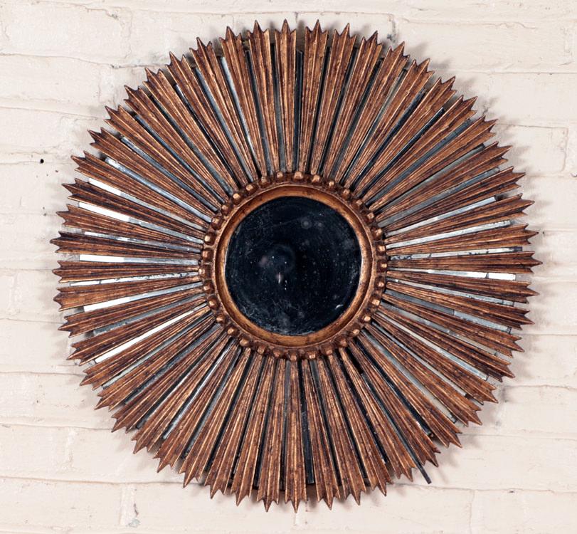 GILT WOOD SUNBURST MIRROR CIRCA 1960: A gilt wood sunburst mirror circa 1960. Dia: 25"