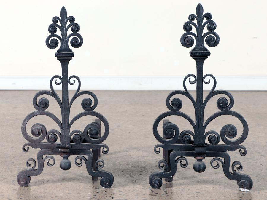 PAIR OF ART DECO WROUGHT IRON ANDIRONS C.1930: A pair of Art Deco wrought iron andirons circa 1930. Ht: 26.5" Wd: 14.25" Dpth: 22"
