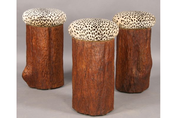 SET 3 CARVED TREE STUMP BAR STOOLS FAUX LEOPARD: A set of three chip carved tree stump bar stools with faux leopard uphosltered seats. Ht: 27" Diameter: 15" ***PLEASE NOTE: All property shall be paid for by the purchaser within five (5) business day