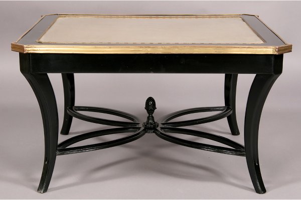 REGENCY STYLE EBONIZED COFFEE TABLE GILT BRONZE: Regency style ebonized coffee table with inset eglomise gilt top, bronze trim, downswept legs and clover leaf stretcher circa 1940. Ht: 18" Width: 31" Depth: 31" ***PLEASE NOTE: All property shall be