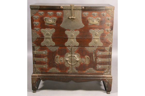 ANTIQUE 2 DOOR KOREAN CABINET: Antique Korean cabinet with full front over two doors decorated with incised applied brass circa 1930. Ht: 43" Width: 39" Depth: 17" ***PLEASE NOTE: All property shall be paid for by the purchaser wit