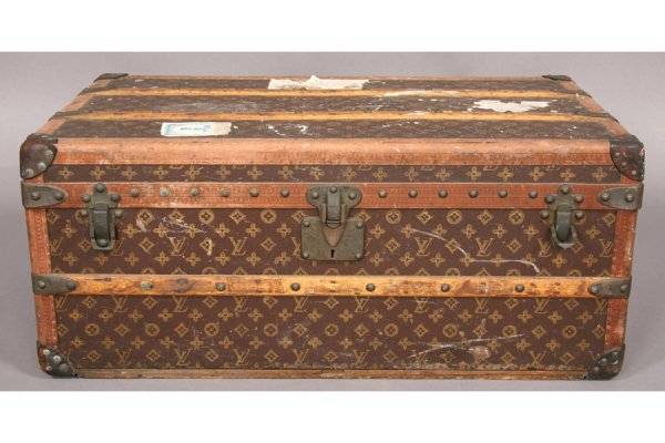 ANTIQUE LOUIS VUITTON STEAMER TRUNK: Antique Louis Vuitton travelling trunk circa 1920. Ht: 13.5" Width: 33" Depth: 18.75" ***PLEASE NOTE: All property shall be paid for by the purchaser within five (5) business days of the sale. Kamelo