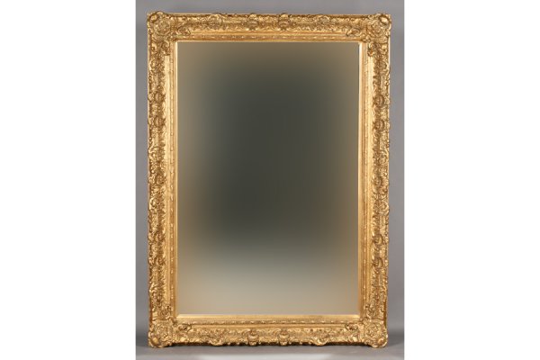OVERSCALED COMPOSITION BEVELED GLASS MIRROR: Overscaled composition gold decorated beveled glass mirror. Ht: 63" Width: 87" Depth: 5" ***PLEASE NOTE: All property shall be paid for by the purchaser within five (5) business days of the sale. Kame