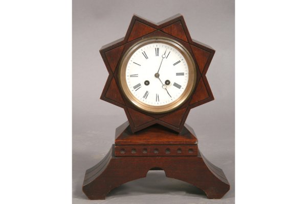 VINTAGE STAR SHAPED MANTLE CLOCK LABELED PHILA: A vintage star shaped mantle clock with William Heine, Philadelphia label underneath circa 1870. Ht: 13" Width: 11" Depth: 4" ***PLEASE NOTE: All property shall be paid for by the purchaser within fiv