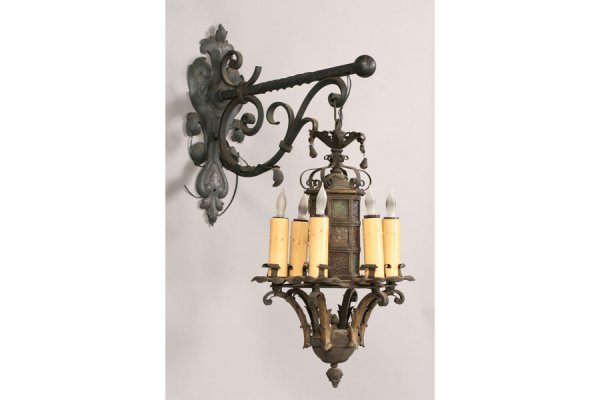 UNUSUAL AESTHETIC WROUGHT IRON HANGING LIGHT 6: Unusual aesthetic style wrought iron hanging light with scroll decorated bridge bracket supporting six lights circa 1940. Ht: 21" Width: 12" Depth: 16.5" ***PLEASE NOTE: All property shall be paid for