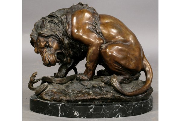 BRONZE STATUE LION SNAKE MARBLE: Impressive bronze statue of a lion slaying a snake on a marble base. Unsigned. Ht: 14" Width: 17" Depth: 10" ***PLEASE NOTE: All property shall be paid for by the purchaser within five (5) business da