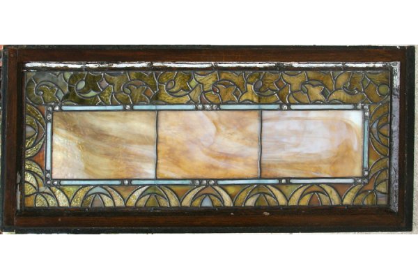 ANTIQUE VICTORIAN LEAD STAINED GLASS TIFFANY: Victorian leaded and stained glass transome attributed to Tiffany Studios circa 1885. Having a central rectangle surrounded by very small rock jewels. Ht: 14.5" Width: 35" ***PLEASE NOTE: All property