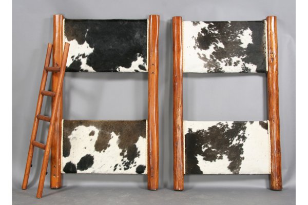 RUSTIC RANCH STYLE BUNK BED COWHIDE TIMBER: A rustic ranch style bunk bed with natural timber frame and cowhide head and foot board circa 1960. Ht: 68" Depth: 41" ***PLEASE NOTE: All property shall be paid for by the purchaser within five (5) b