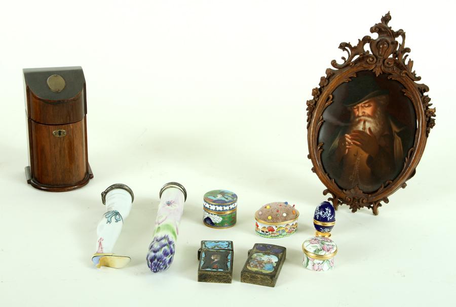 LOT OF 10 ASSORTED DECORATIVE OBJECTS: A lot of ten assorted decorative objects. To include: A hand painted Hutschenreuther plaque in Black Forest frame Four Bilston & Battersea boxes Two enamel and silver match safes Two porcelain bottles