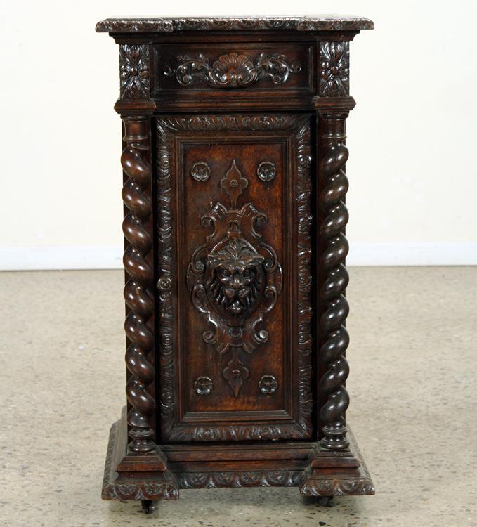 OAK NIGHT STAND HAVING LION CARVED DOOR: A carved oak night stand having lion carved door under a single drawer circa 1880. Ht: 36.5" Wd: 19.25" Dpth: 17"