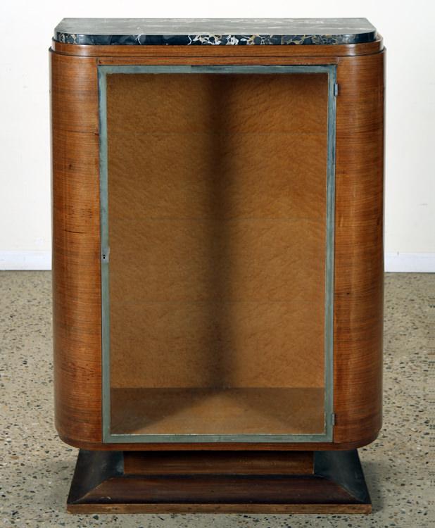 FRENCH ART DECO MARBLE TOP DISPLAY CASE C.1935: A French Art Deco marble top display case having curved sides and a nickel over bronze door frame circa 1935. No keys or shelves are present. Ht: 51.25" Wd: 35.5" Dpth: 17"