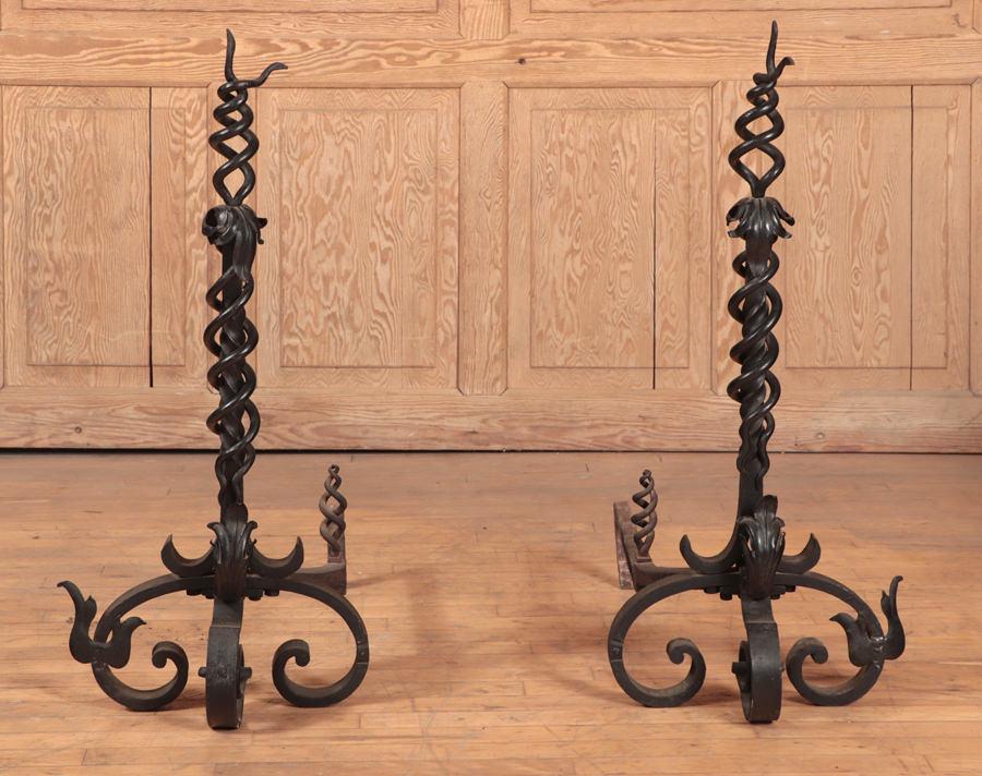 PAIR WROUGHT AND TWISTED IRON ANDIRONS C.1910: A pair of wrought and twisted iron andirons circa 1910. Ht: 36" Wd: 15.75" Dpth: 26.5"
