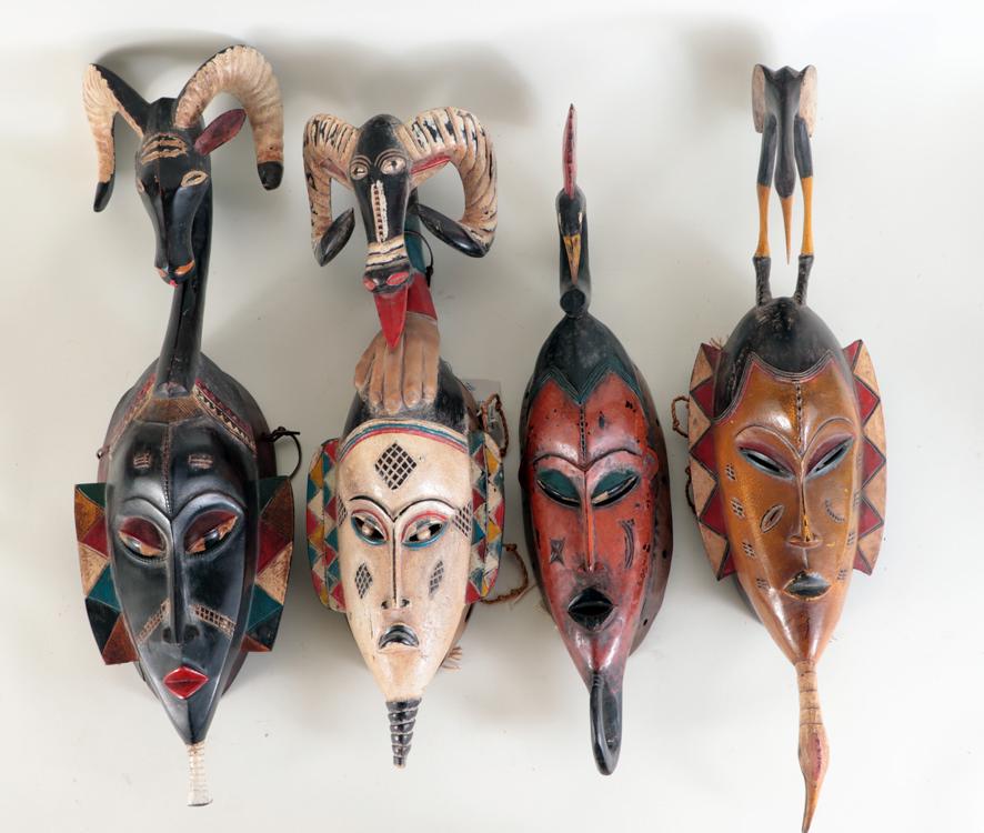 FOUR AFRICAN CARVED WOOD TRIBAL MASKS (1 of 6)