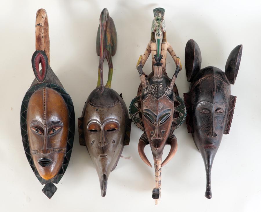 FOUR AFRICAN CARVED WOOD TRIBAL MASKS (1 of 6)