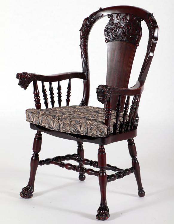 VICTORIAN CARVED ARM CHAIR WIT: A late Victorian carved mahogany arm chair with gargoyle heads. Ht: 42.5" Wd: 25" Dpth: 24.75" Seat: 20.75"