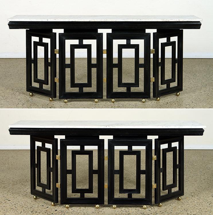 PAIR CONSOLE TABLES MANNER JAMES MONT C. 1950: A pair of ebonized and marble top console tables in the manner of James Mont resting on brass ball feet circa 1950. Ht: 31" Wd: 67.5" Dpth: 16"