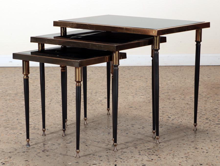FRENCH NEST OF TABLES BLACK GLASS TOPS C.1950: A French nest of tables having black glass tops and brass details circa 1950. Ht: 20.25" Width: 24.25" Depth: 16"