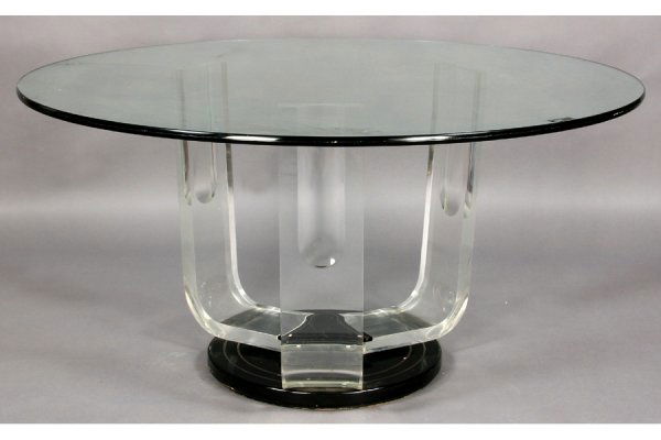 ART DECO STYLE DINING TABLE GLASS LUCITE BRASS: Art Deco style dining table with large round glass top, shaped Lucite legs and turned wood base with inlaid brass circa 1940. Ht: 29.75" Width: 60" ***PLEASE NOTE: All property shall be paid for by th