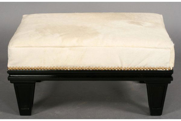 VINTAGE MODERN EBONIZED LEATHER OTTOMAN: Stylish ebonized ottoman with hide upholstered cushion seat over molded and tapered legs circa 1950. Ht: 11" Width: 22" Depth: 16" ***PLEASE NOTE: All property shall be paid for by the purchaser withi