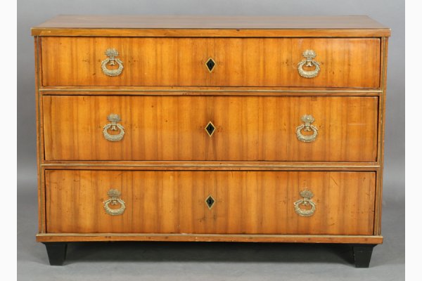 ANTIQUE BIEDERMEIER NEOCLASSICAL BUTLER CHEST: Antique Biedermeier neoclassical butler chest with bronze trim, three drawers, inlaid diamond shaped escutcheon and ebonized block feet circa 1820. Top drawer fitted as a desk. Ht: 35" Width: 49" Dept