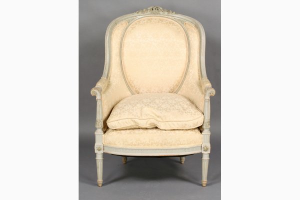 ANTIQUE FRENCH LOUIS XVI CARVED BERGERE ARMCHAIR: French Louis XVI carved and painted bergere with ornately carved arched back, downswept arms and fluted legs circa 1910. Ht: 42" Width: 29" Depth: 25" ***PLEASE NOTE: All property shall be paid for by