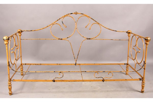 ANTIQUE FRENCH IRON CAMPAIGN STYLE DAYBED: Antique French iron campaign style daybed with cast and wrought iron decorations circa 1910. Remains of old paint. Ht: 32.5" Width: 72" Depth: 33" ***PLEASE NOTE: All property shall be paid for by the