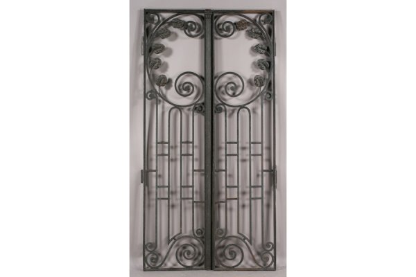 PAIR CAST IRON ENTRY GATES GARDEN: Pair of cast iron entry gates with handsome scrolling design circa 1920. Perfect for the entryway to your garden. Ht: 89" Width: 48" ***PLEASE NOTE: All property shall be paid for by the purchaser wit