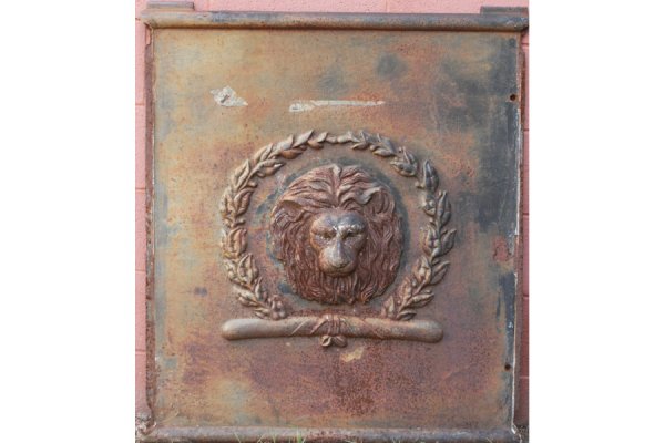 PAIR IRON FIREBACKS FIREPLACE LION FACE: Pair of iron firebacks having a well detailed lion face surrounded by wreath. Ht: 40" Width: 35" ***PLEASE NOTE: All property shall be paid for by the purchaser within five (5) business days of the sa