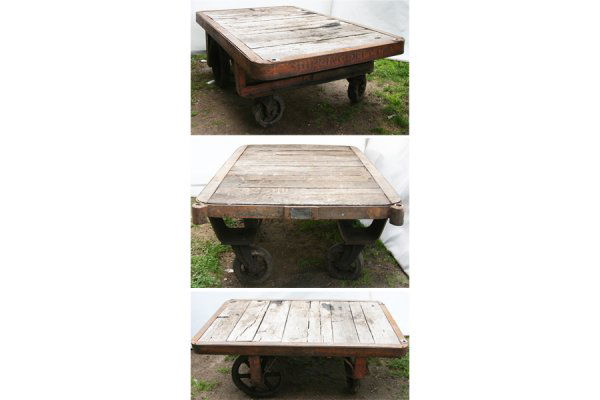 3 INDUSTRIAL COFFEE TABLES CARTS WOOD PLANK TOP: Three Industrial coffee tables having wood plank top, iron frames and spoked wheels circa 1915. Recently removed from a Princeton, New Jersey estate. Ht: 20" Width: 60" Depth: 36" ***PLEASE NOTE: All