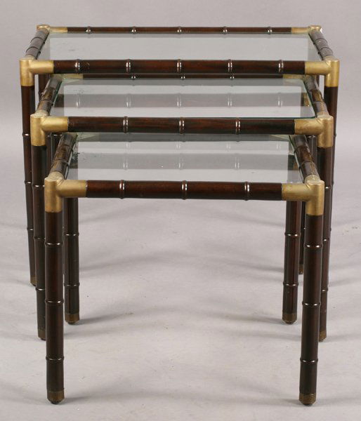 SET 3 BILLY HAINES FAUX BAMBOO NESTING TABLES: A set of three graduated Billy Haines style faux bamboo nesting tables with brass corners and feet circa 1960. Ht: 20.5" Width: 27" Depth: 16.5"
