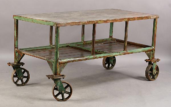 LARGE INDUSTRIAL METAL CART STEEL TOP: A large industrial metal cart with steel top over lower shelf raised on large scale casters. Ht: 31" Width: 60" Depth: 30"