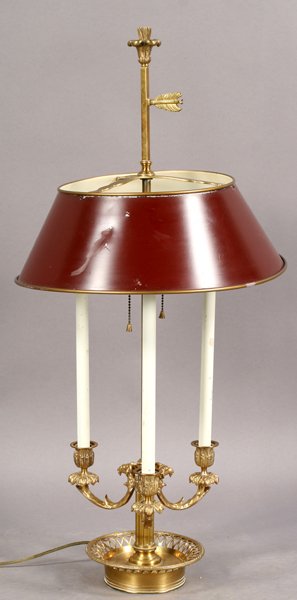 FRENCH BRASS BOULETTE LAMP TOLE PAINTED SHADE: A French Empire style brass boulette lamp with tole painted shade, rams head and foliate decorated arms and reticulated base. Ht: 33" Diameter: 16"