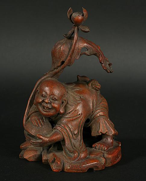 ANTIQUE CHINESE WOOD CARVING LIU-HAN 19TH C.: Nineteenth century or older Chinese wood carving of mythological figure Liu-Han shown with sprouting water lily in hand and toad on his back. Ht: 7.25" Width: 4"