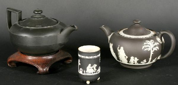 3 PC LOT: JASPERWARE WEDGWOOD TEA POTS VESSEL: A lot of three pieces of basalt Jasperware Wedgwood including two tea pots and a small vessel. All 20th century. Ht: 5" Width: 9" Depth: 5.5"