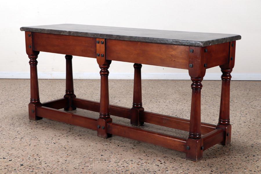 BRAZILIAN HALL TABLE LEATHER WRAPPED TOP C.1940: A Brazilian hall table with iron bolt decoration and leather wrapped top circa 1940. Ht: 30.5" Wd: 65" Dpth: 21"