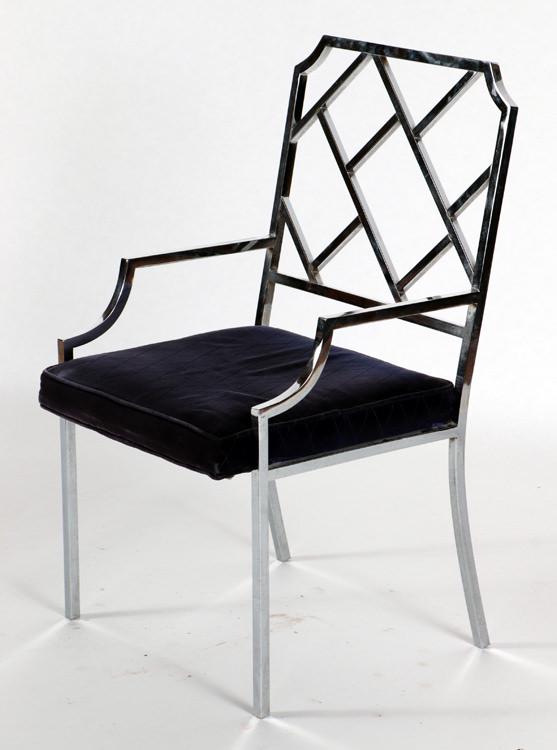 CHROME CHIPPENDALE STYLE MODERN ARM CHAIR: A chrome Chippendale style modern arm chair. Ht: 38" Wd: 21.5" Dpth: 22.5" Seat: 18.5"