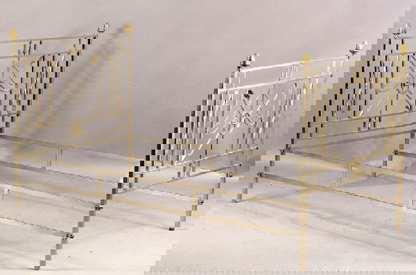 CHROME BRASS CLASSICAL DAYBED CROSSED ARROW: A chrome and brass classical style daybed having central crossed arrow decoration circa 1960. Ht: 38.5" Width: 75" Depth: 39.5"