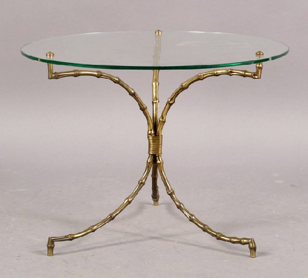 FRENCH BAQUES FAUX BAMBOO GLASS TOP TABLE: A French Baques style faux bamboo style drinks table having a naturalistic base and glass top circa 1960. Ht: 17.5" Diameter: 23.5"