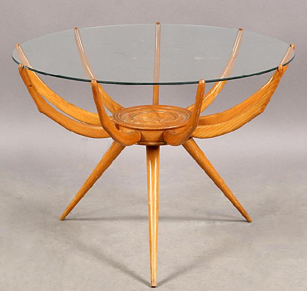 MODERN CARLO DICARLI RAGNO COFFEE TABLE GLASS TOP: A mid century modern Carlo DiCarli Ragno coffee table with glass top supported by open rib shaped wood base circa 1950. Ht: 19" Diameter: 26"
