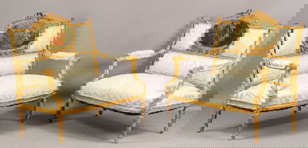 PAIR ANTIQUE FRENCH GILTWOOD CARVED SETTEES: A pair of antique French giltwood carved settees circa 1900. Each having a central pastorial romantic painting framed by openwork carving and upholstery over open arms and upholstered seat. Raised on