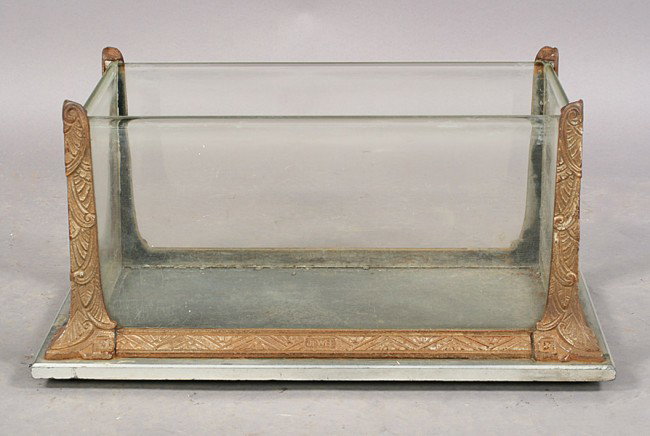 ANTIQUE ART DECO LABELED CAST IRON TERRARIUM: Antique Art Deco labeled Jewel cast iron terrarium having incised corner supports and frame circa 1920. Ht: 12" Width: 23.5" Depth: 13.5" Terms & Conditions: PLEASE NOTE: All property shall be paid fo